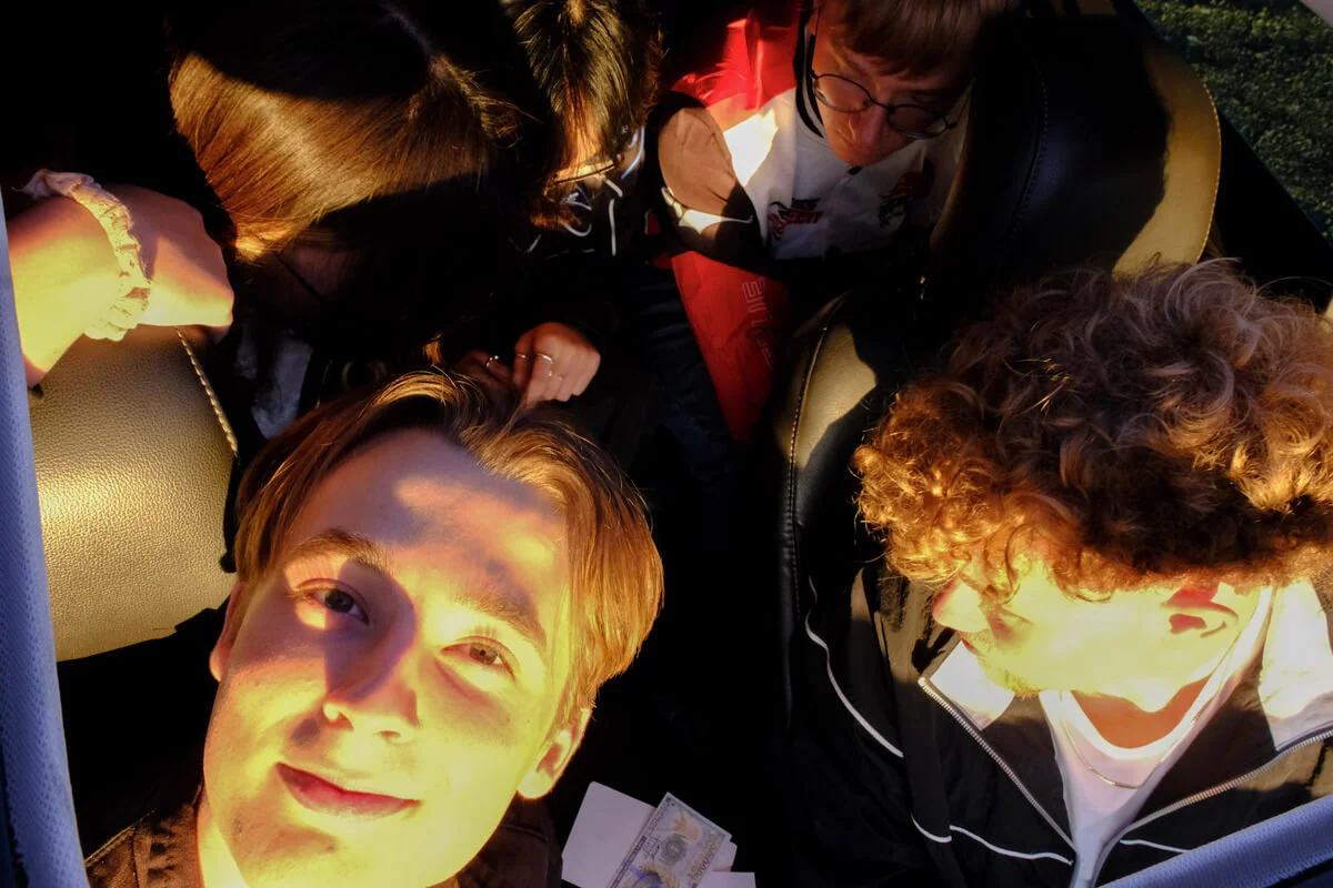 Overhead view of party members inside a car