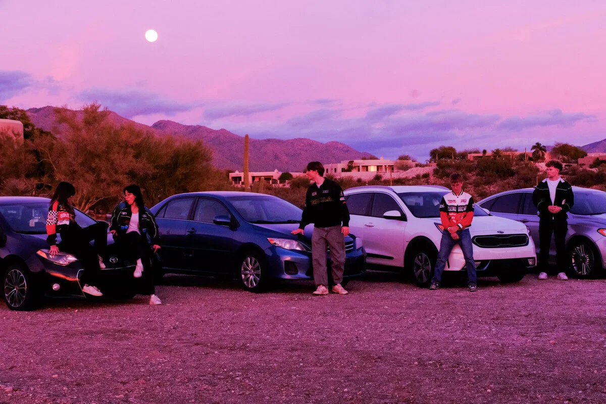 All party members dispersed in front of cars