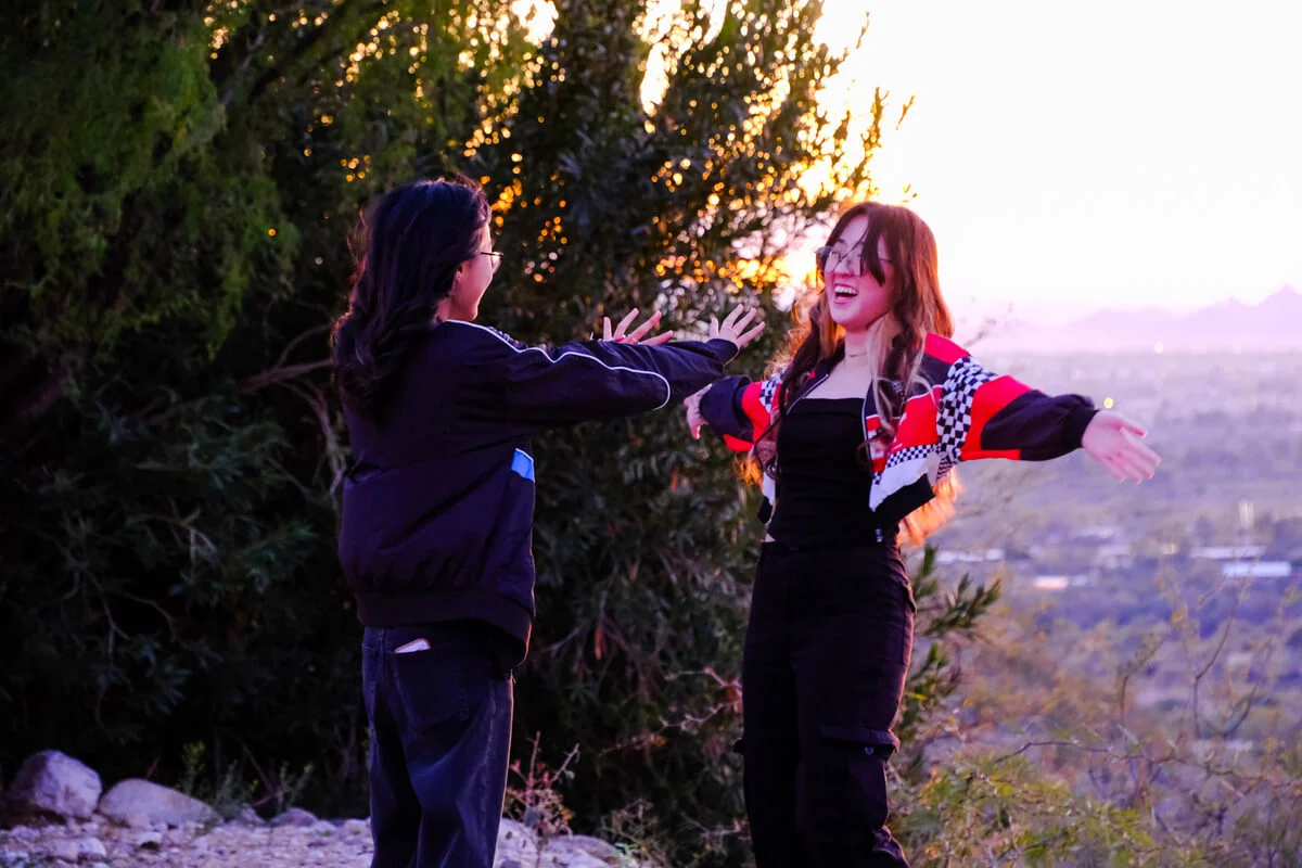 Lydia pushing Sophie off a cliff